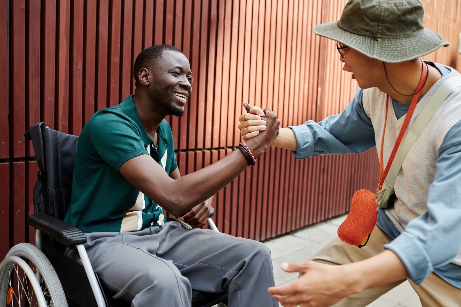 Black Man with Disability Greeting Friend